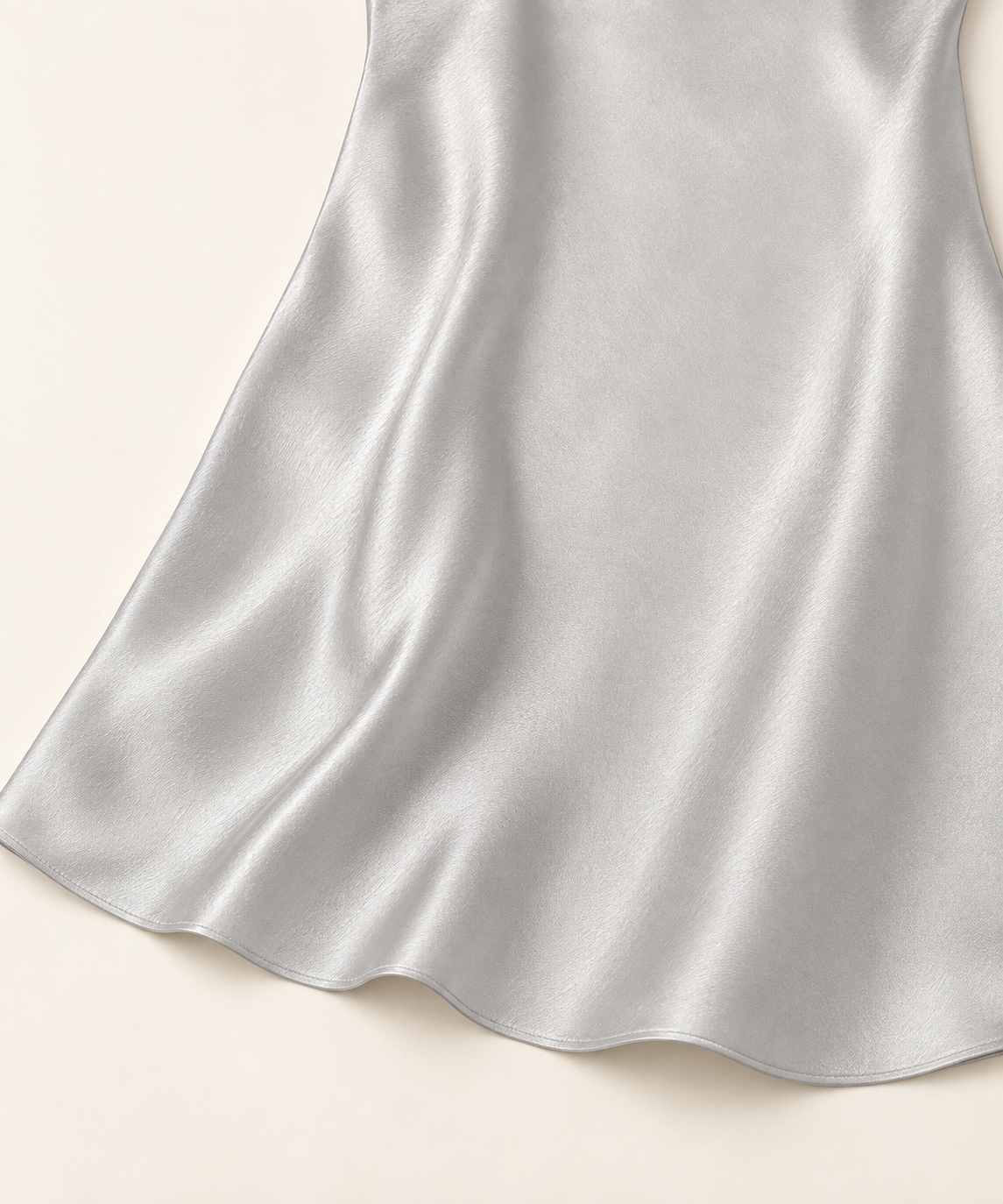 silver mini slip dress · detail · AI-assisted editorial image